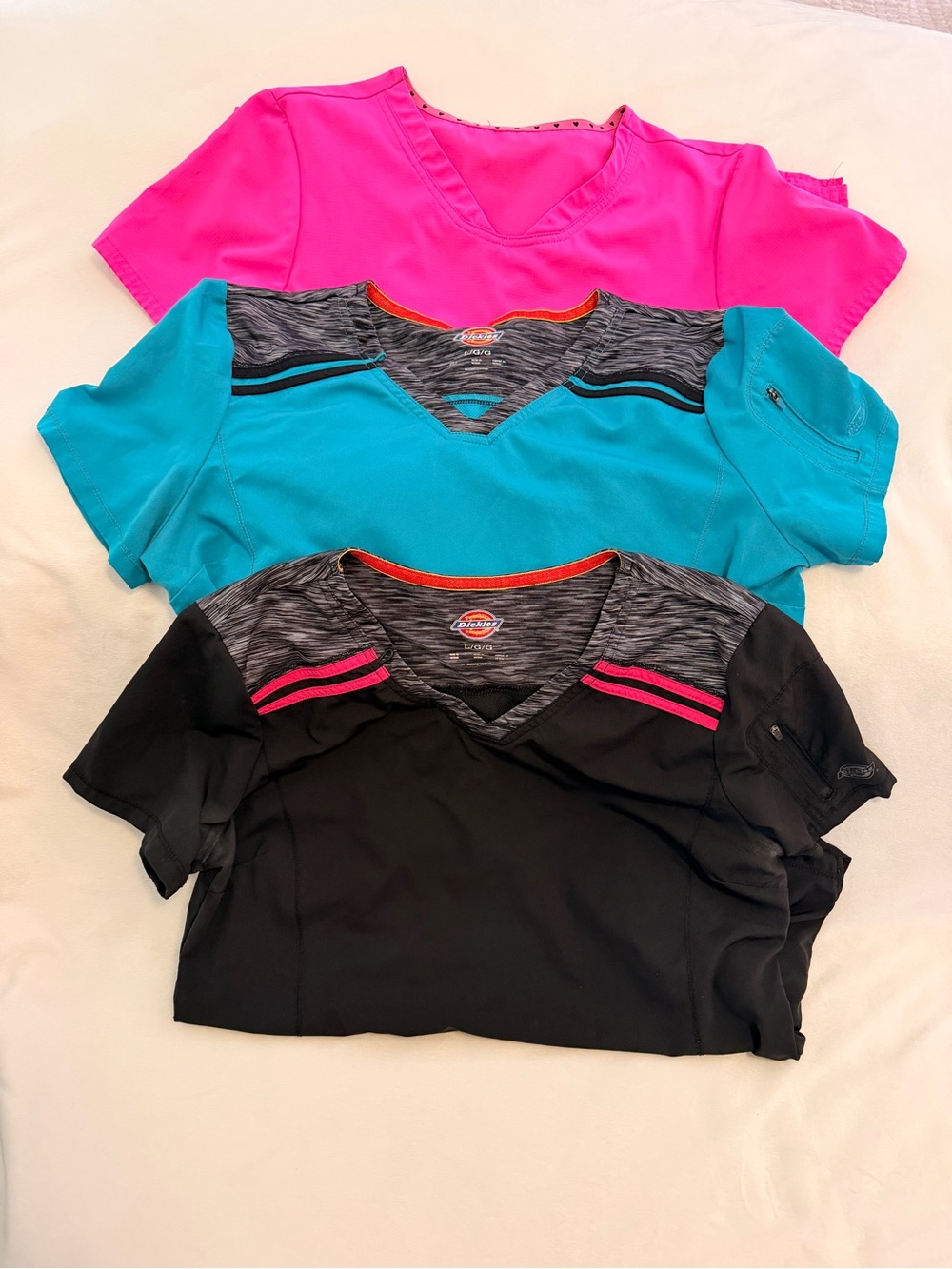 Scrub tops Women's size Large. Pink, Black and Teal.